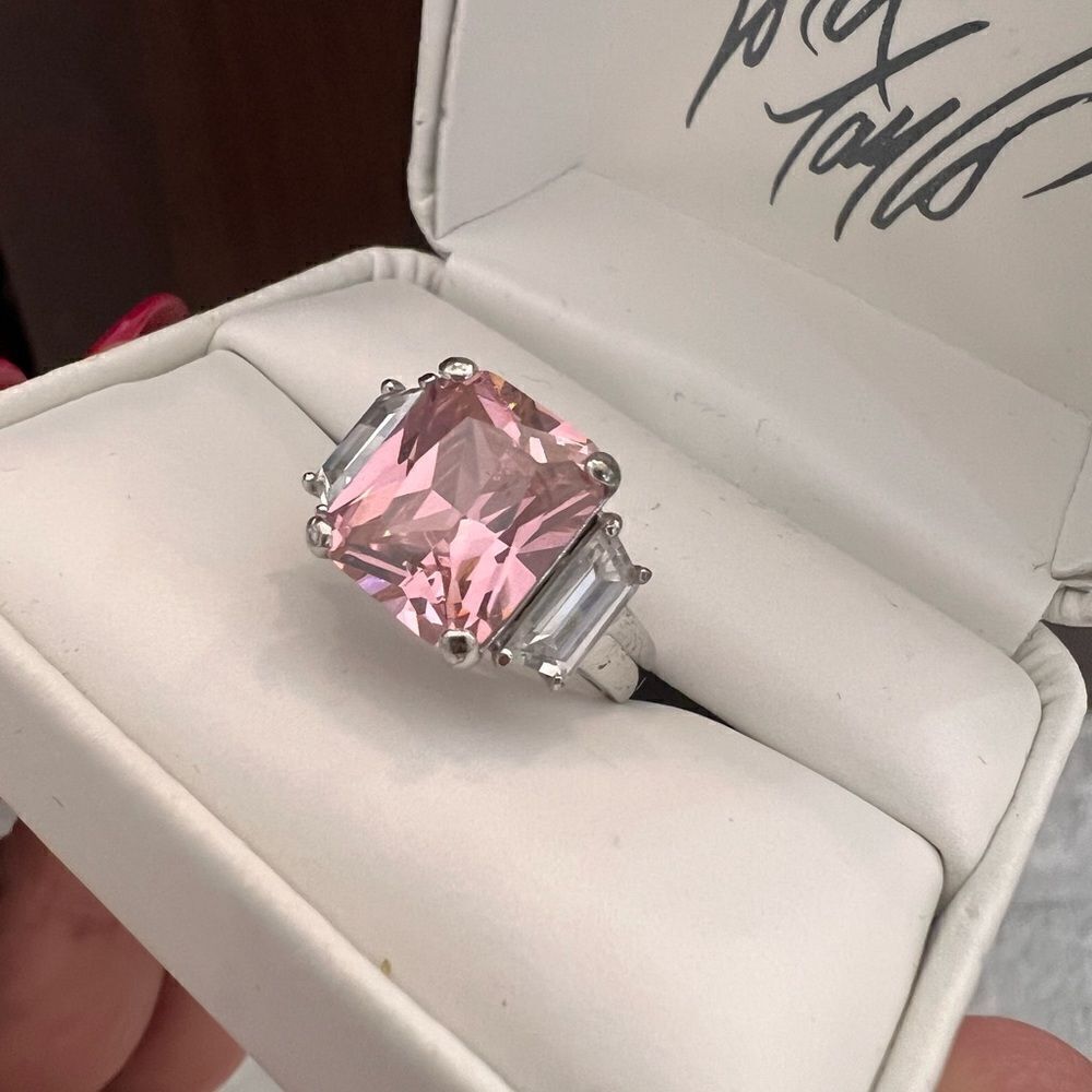 Sterling silver ring and pink sapphire looking stone.